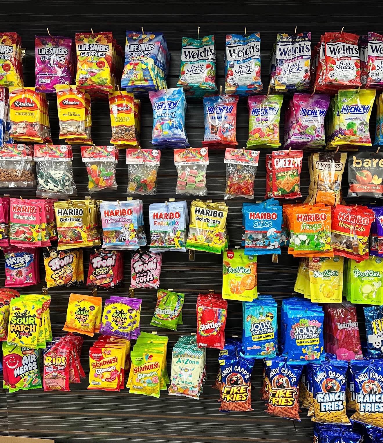 Wall of hanging candy and gummy bags