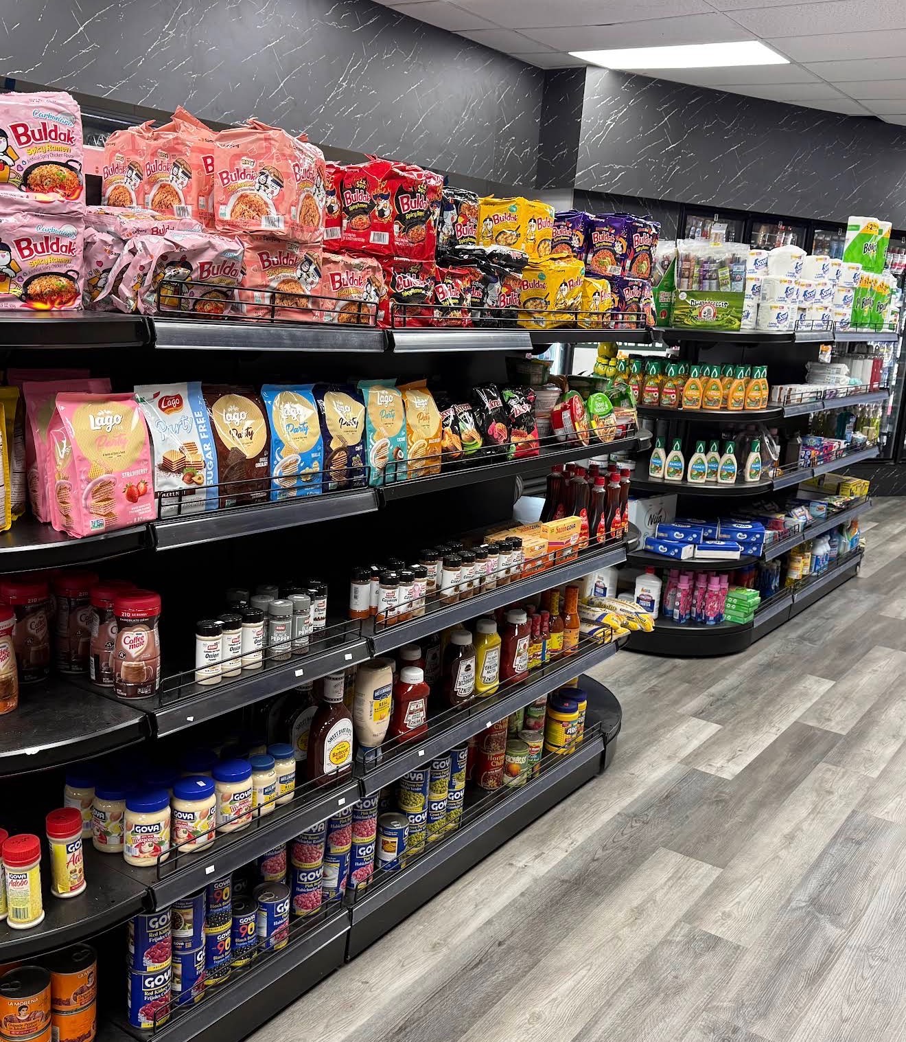 Grocery aisle with canned goods, sauces and pantry staples