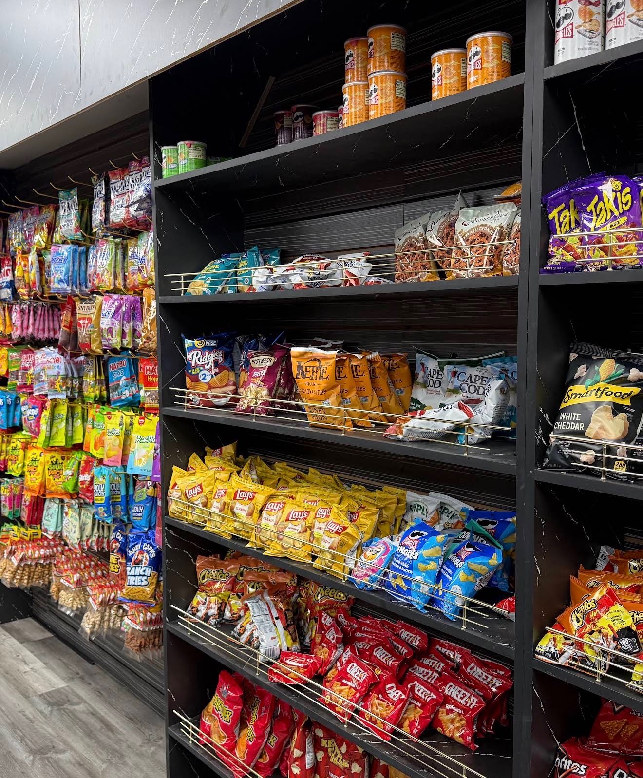 Shelves of chips and salty snacks
