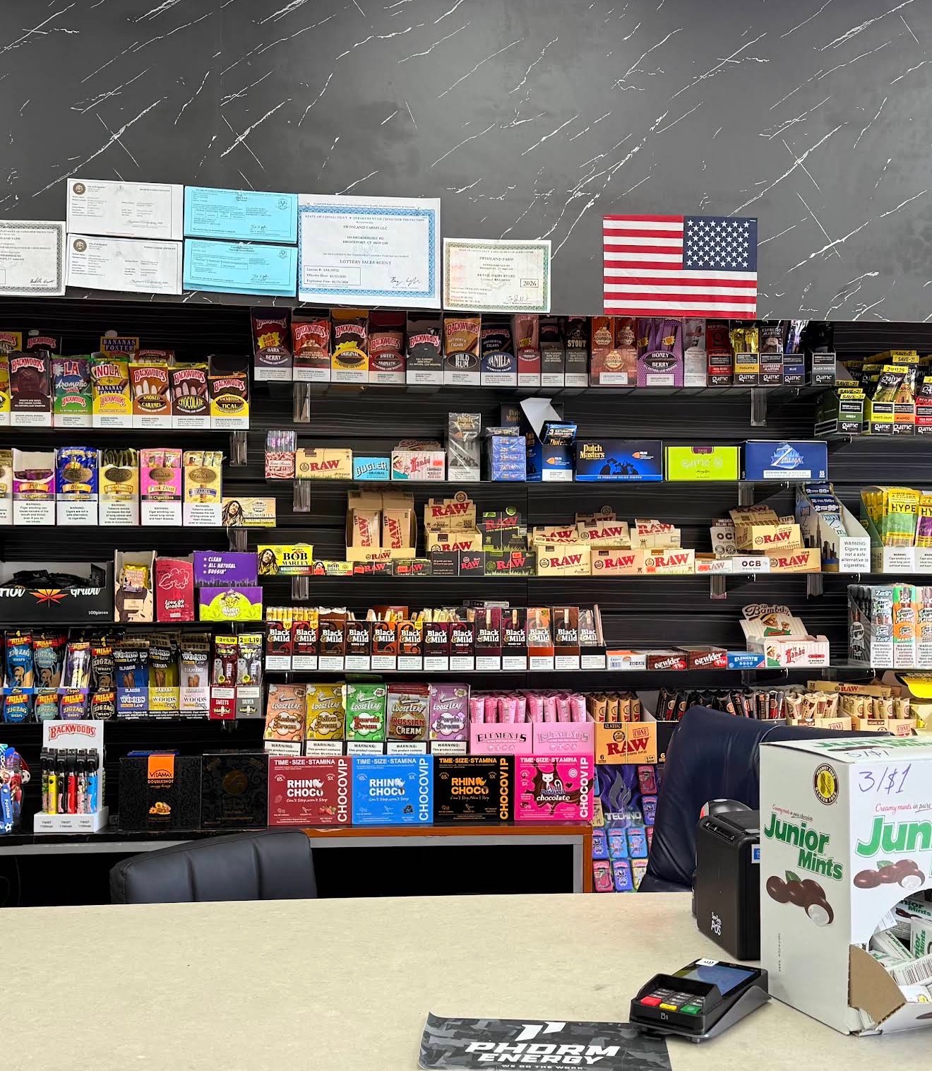 Smoke shop wall with rolling papers, wraps and cigars